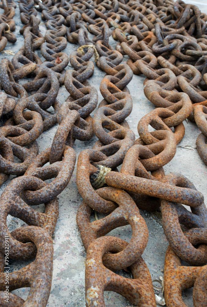 rusty chain on the pier. Stintino, Sardinia, Italy rusty chain on the pier. Stintino, Sardinia, Italy