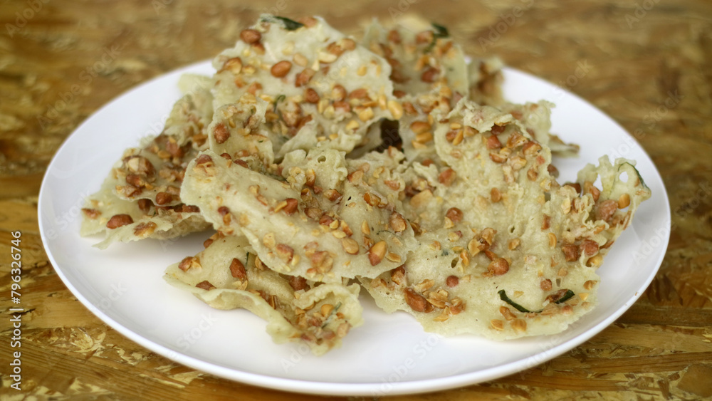 Peanut crackers or peyek kacang. Savory and crunchy snack from Indonesia. Peanut crackers or peyek kacang. Savory and crunchy snack from Indonesia.