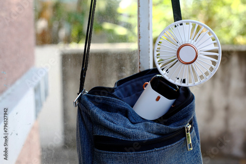 Portable rechargeable electric fan in a bag