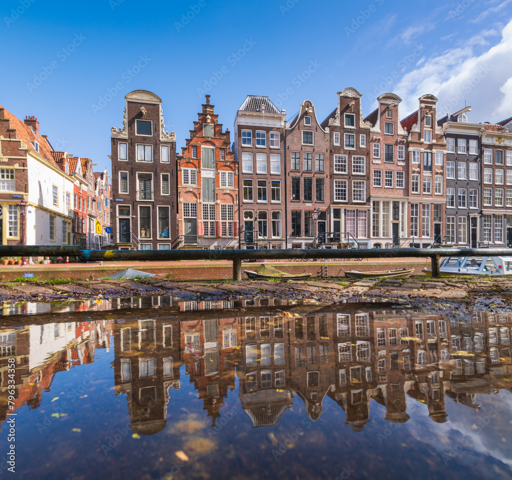 Reflection of houses of Amsterdam on water