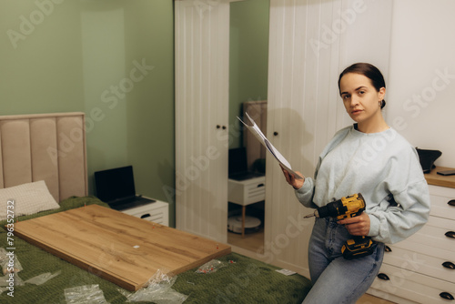 Stressed woman feeling frustrated and confused while reading the manual instructions to assembly furniture and do home improvements