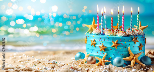 A birthday cake with colorful sprinkles and twenty-one colorful candles on the beach photo