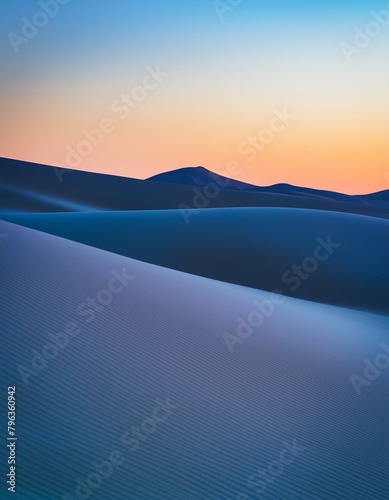 An evening scene with the last light of twilight casting long shadows and painting the dunes in hues of lavender and soft blue