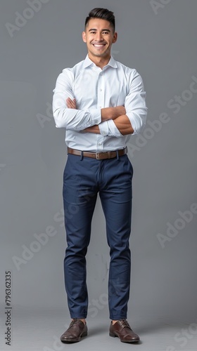 create an image of a man office worker standing full body smiling, he is wearing a formal deep blue office uniform, realistic photography, gray background