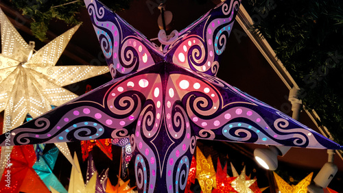 Herrnhut stars, bright colorful decoration at the Christmas market, star shaped lamp photo