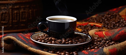 Ethiopian traditional coffee cup and dark coffee beans