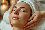 A woman lies on a massage table and gets beauty treatment in a spa salon, with a professional cosmetologist doing a laser facial microfoam facade.