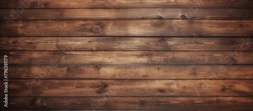 A wooden wall with a dark brown stain