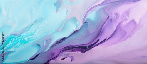 Close-up of swirling purple and blue paint mixture photo