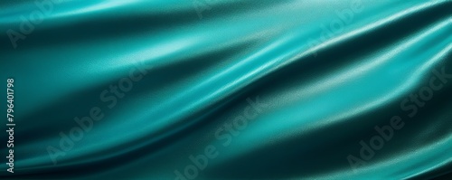 Teal foil metallic wall with glowing shiny light, abstract texture background blank empty with copy space 