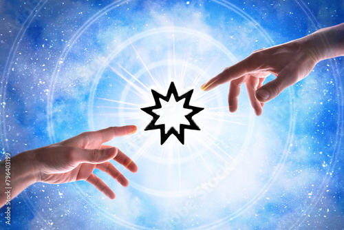 Representation of the universe and hands pointing the Bahai symbol photo