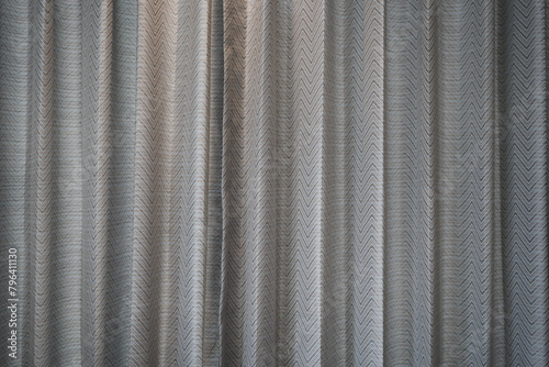 Curtain hanging and creating wavy line patterns decoration in home © Dontree