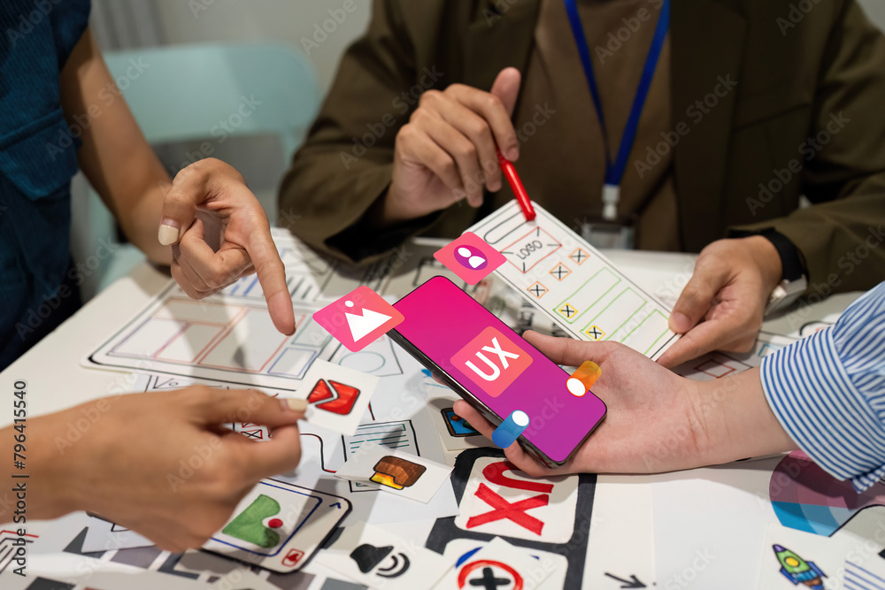 © itchaznong - ux developer and UI designer team brainstorm together about designing application interface layout. Creative digital development agency. UX UI concept