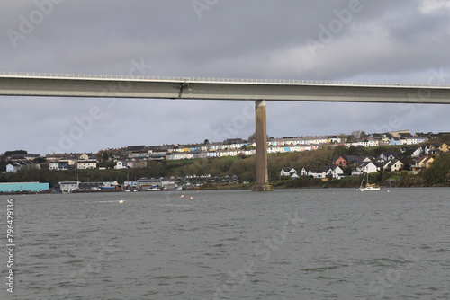 A view under the Claddau Bridge of the cottages in Neyland  in Pembrokeshire, Wales, UK. photo