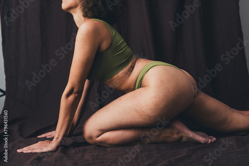 Photo of lovely young lady tempting posing dressed khaki lingerie studio background no filter self acceptance all body perfect