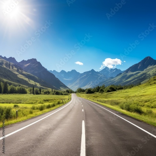 b'The road is surrounded by high mountains and green fields'