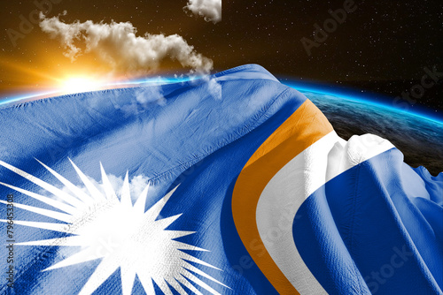 Marshall Islands national flag cloth fabric waving on beautiful night global cloud Background. photo