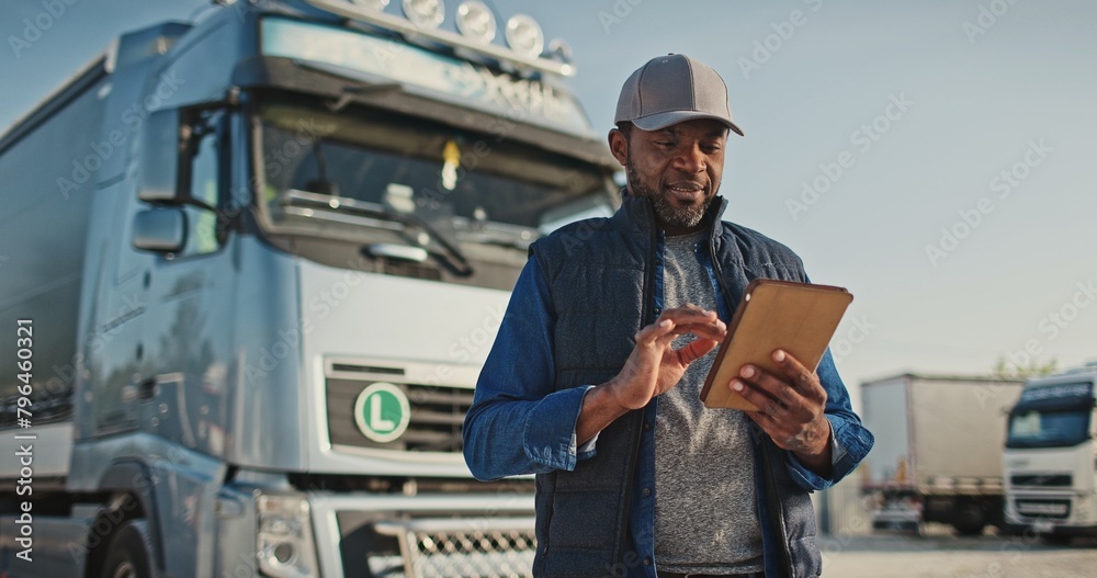 custom made wallpaper toronto digitalAfrican American professional truck driver setting up navigation for destination. Checking his route on tablet computer and standing by long vehicle. Transportation service.