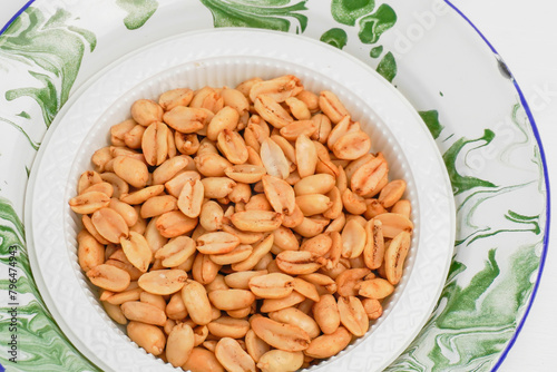 Original savory onion beans fried in a container on a white background