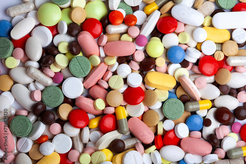 Colored pills, tablets and capsules background