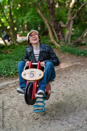 young woman has fun as a child