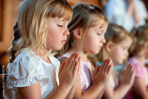 Children praying in church service