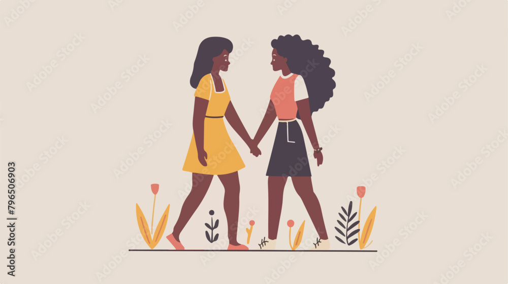 Two strong females walk together and hold hands