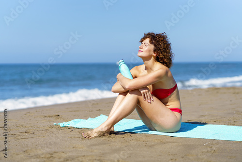 Slim woman relaxing on seacoast
