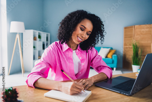 Photo of pretty young girl make notes online lecture entrepreneur wear trendy pink outfit modern interior indoors office workstation