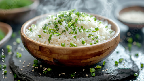 Japan rice with vegetables in a wooden bowl on a stone plate