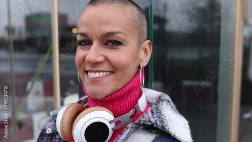 portrait close up smiling bald shaved woman looking at camera