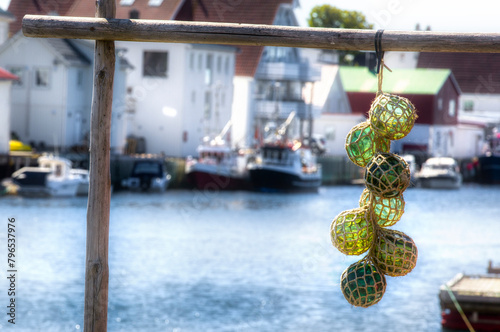 Glass Fishing Floats Decoration on a Rack in Henningsvaer in Lofoten, Norway photo