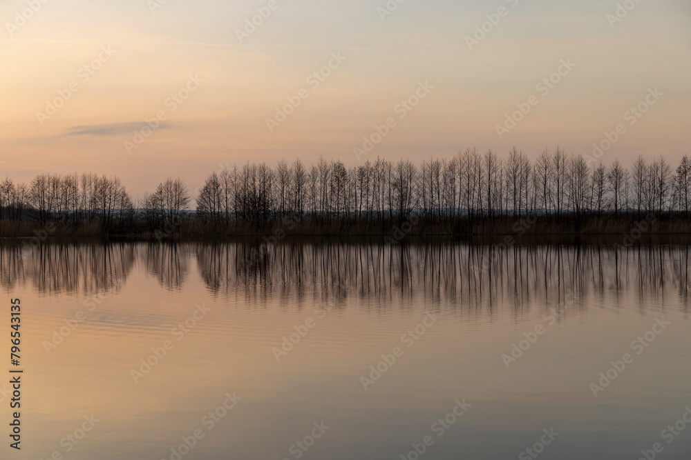 Fototapeta premium reflection of the sky in the lake at sunset