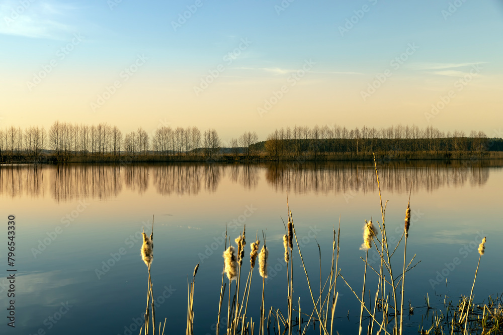 The sky and the lake are red-tinged during sunset