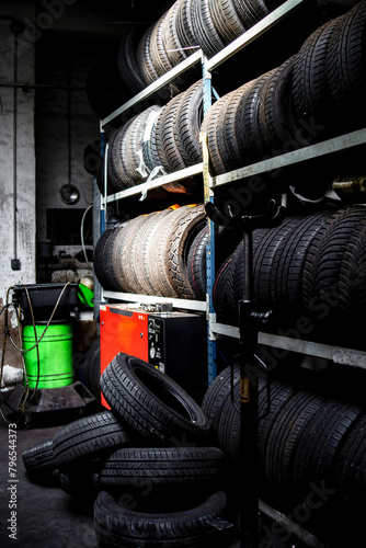 Garage. Car repair. Tools. Rubber tires, wheels.