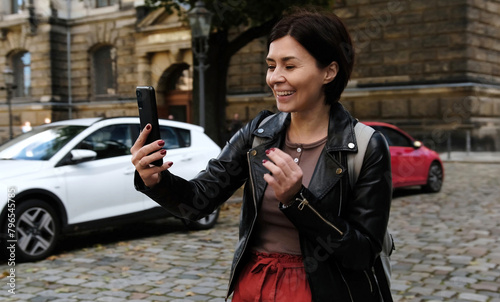 Attractive Woman Explores Touristic Places Of Dresden While Chatting On Messenger