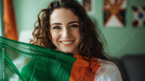 Young woman with flag of Ireland celebrating St. 