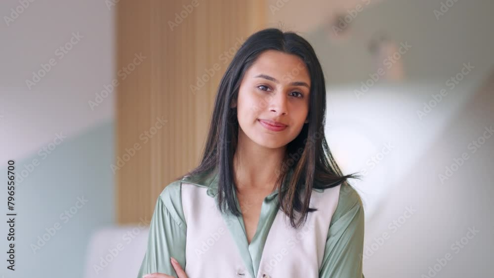 Portrait of young confident happy Indian business woman in corporate office. Smiling businesswoman or student, professional employee, female entrepreneur standing arms crossed looking at camera. Portrait of young confident happy Indian business woman in corporate office. Smiling businesswoman or student, professional employee, female entrepreneur standing arms crossed looking at camera.