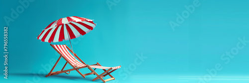 Beach chair and umbrella on blue wall background with copy space photo