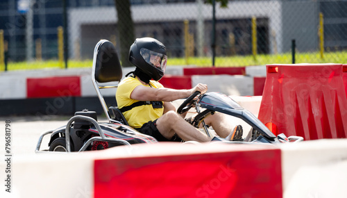 Man In Protective Helmet Driving Go-Kart By Extreme Entettainment Racing Track