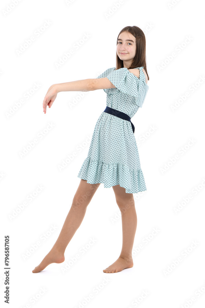 Young beautiful girl in a dress with polka dots on a white background.