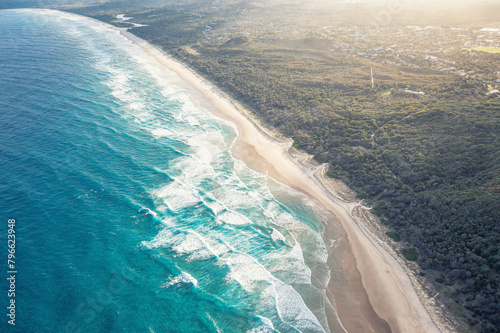 Byron Bay Australia. Scenic view ocean beach patterned waves with white foam. Travel and recreation. photo