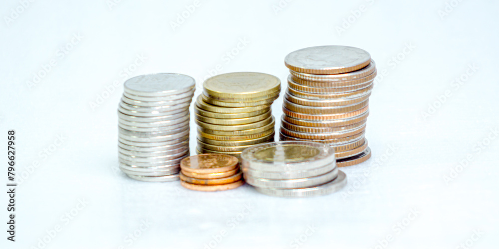Many Thai baht coins arranged in neat layers on a white background, isolated Many Thai baht coins arranged in neat layers on a white background, isolated