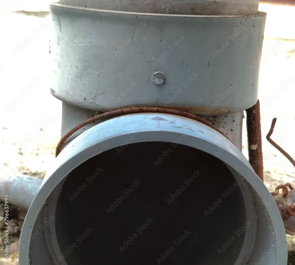 Selective focus. Storm drain - PVC pipe drain.
Selective focus. Storm drain - PVC pipe drain.