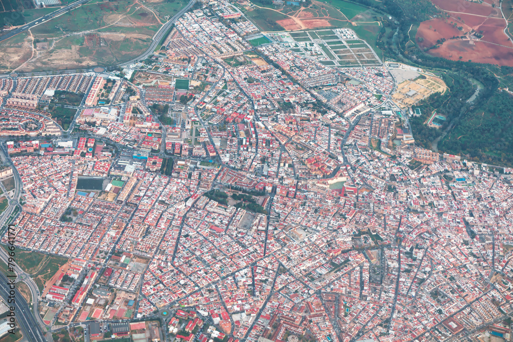 Obraz premium Flying over residential district of Seville, Andalusia Spain. European city view from above