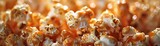 a caramel and peanut popcorn snack, with fluffy popcorn coated in sticky caramel and studded with crunchy roasted peanuts