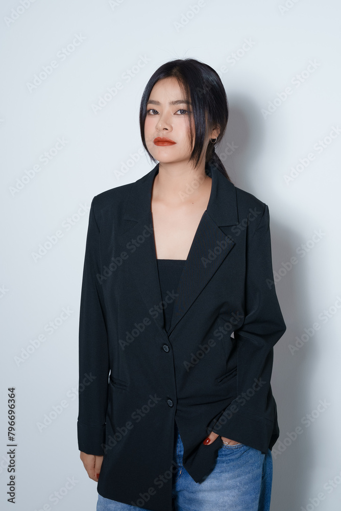 Gorgeous Young Asian female close up face with perfect make-up and red lips. Beautiful woman in black suits look confidence and charming. Gorgeous Young Asian female close up face with perfect make-up and red lips. Beautiful woman in black suits look confidence and charming.