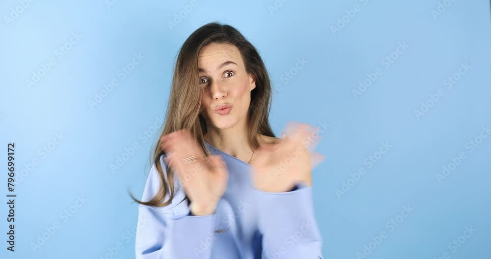 Brunette woman looking camera pointing fingers herself ask me no i do not need it. Girl point on her, waving her hands and say no isolated on blue background.