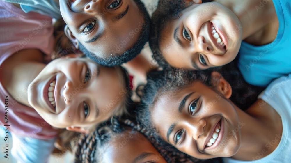 A group of children are smiling and hugging each other A group of children are smiling and hugging each other