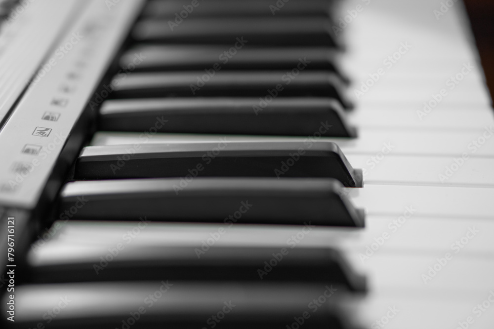 piano keys, blurred background in the distance piano keys, blurred background in the distance
